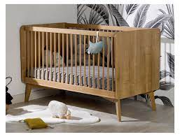 photo d'un lit pour faire dormir son bébé : lit évolutif à barreaux en bois pour tout-petit Babykare.fr